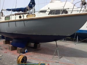 Completed blue antifouling of a Macwester bilge keel sailing yacht